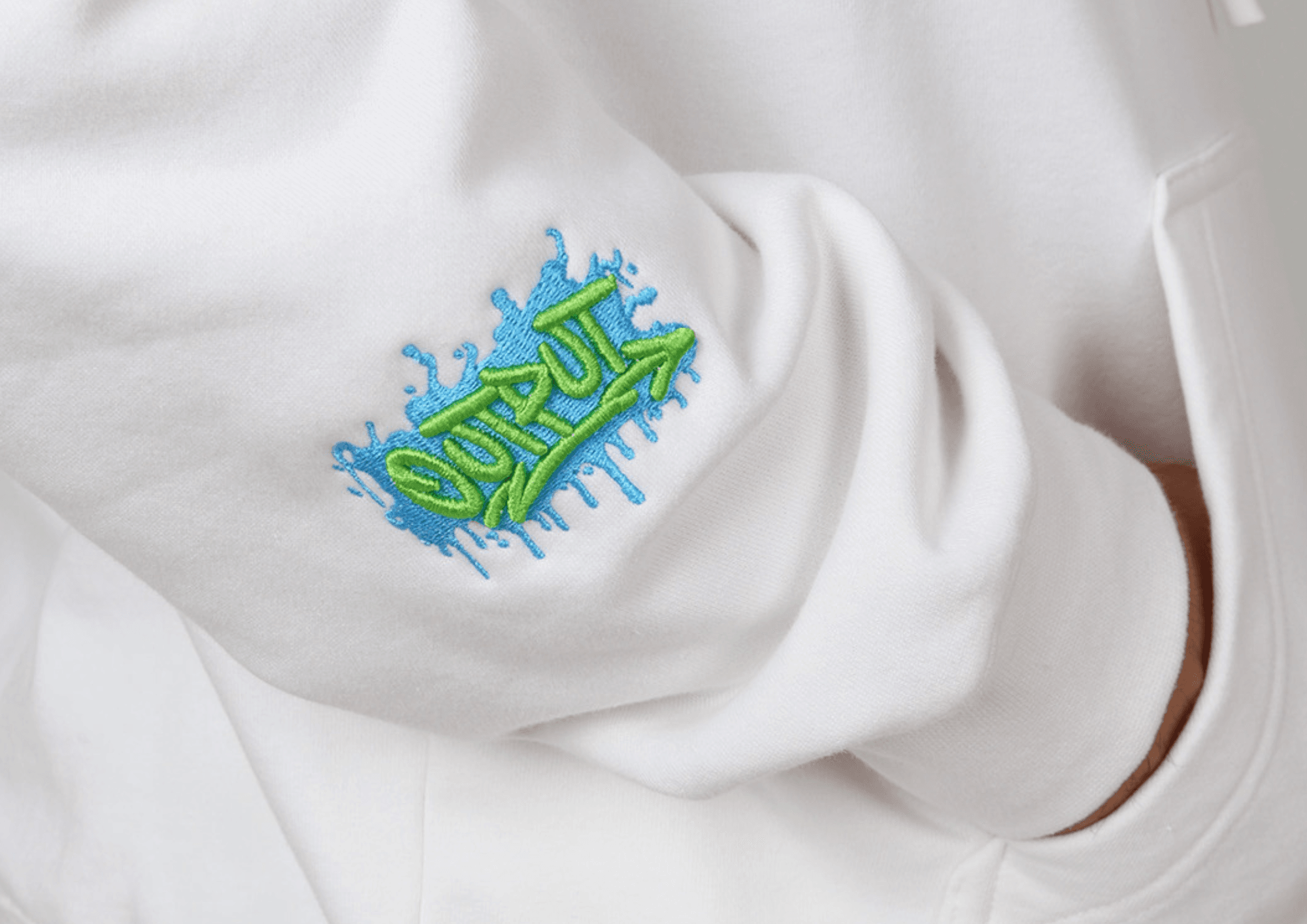 3D puff embroidery raised off a cap — bold lettering with dimensional stitching